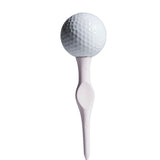Golf ball on a white tee against a white background